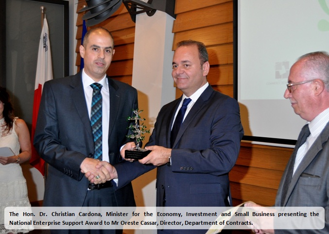 Mr Oreste Cassar receiving the NESA 2016 Award from the Honourable Minister Dr Christian Cardona