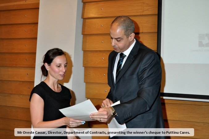 Mr Oreste Cassar presenting the NESA 2016 winner's cheque to Puttinu Cares